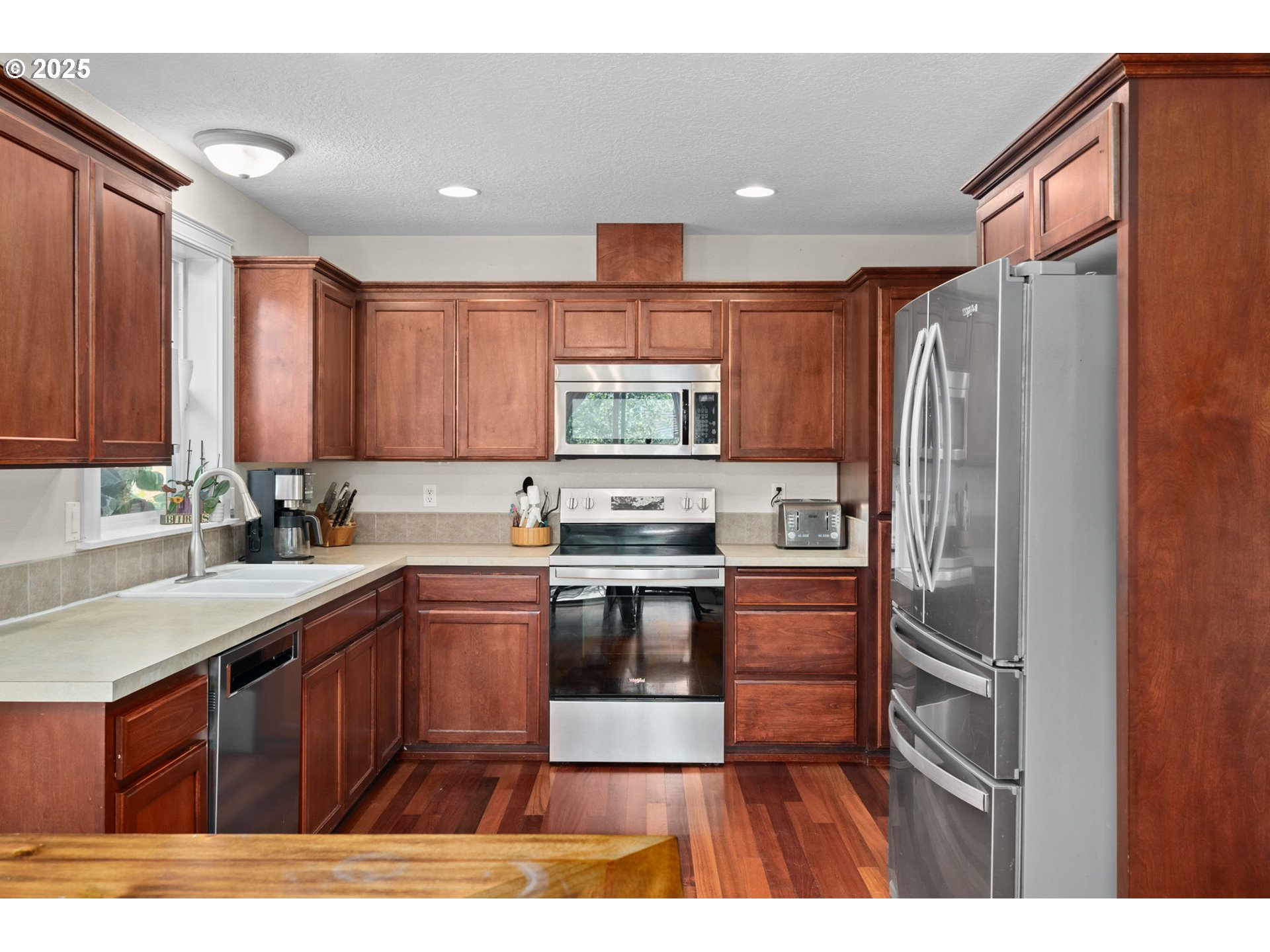720 East Azalea Street Yamhill, OR 97148 - Photo 13 of 48 a kitchen with stainless steel appliances granite countertop a stove a sink dishwasher a refrigerator and a microwave