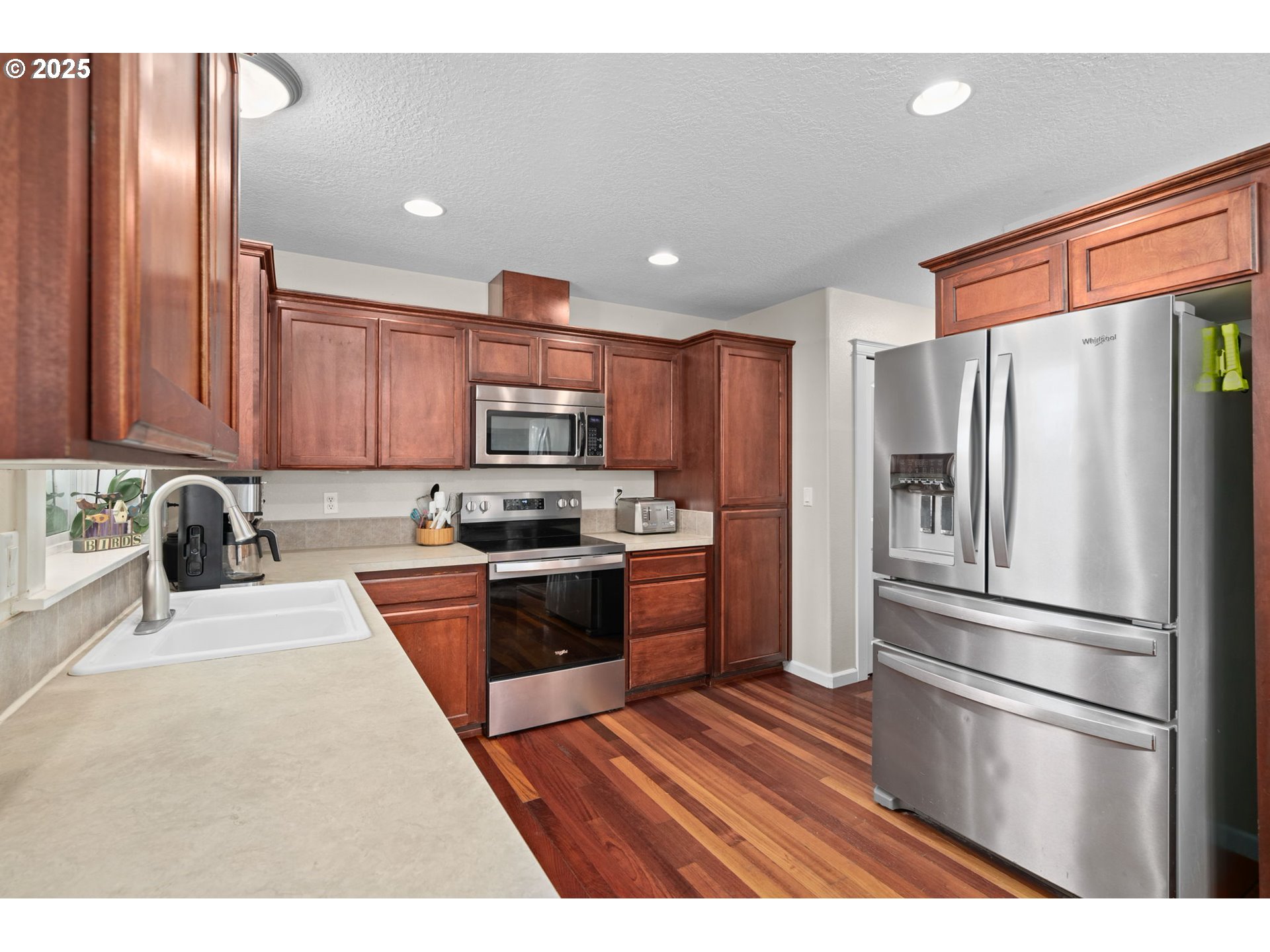 720 East Azalea Street Yamhill, OR 97148 - Photo 16 of 48 a kitchen with stainless steel appliances granite countertop a refrigerator sink and stove