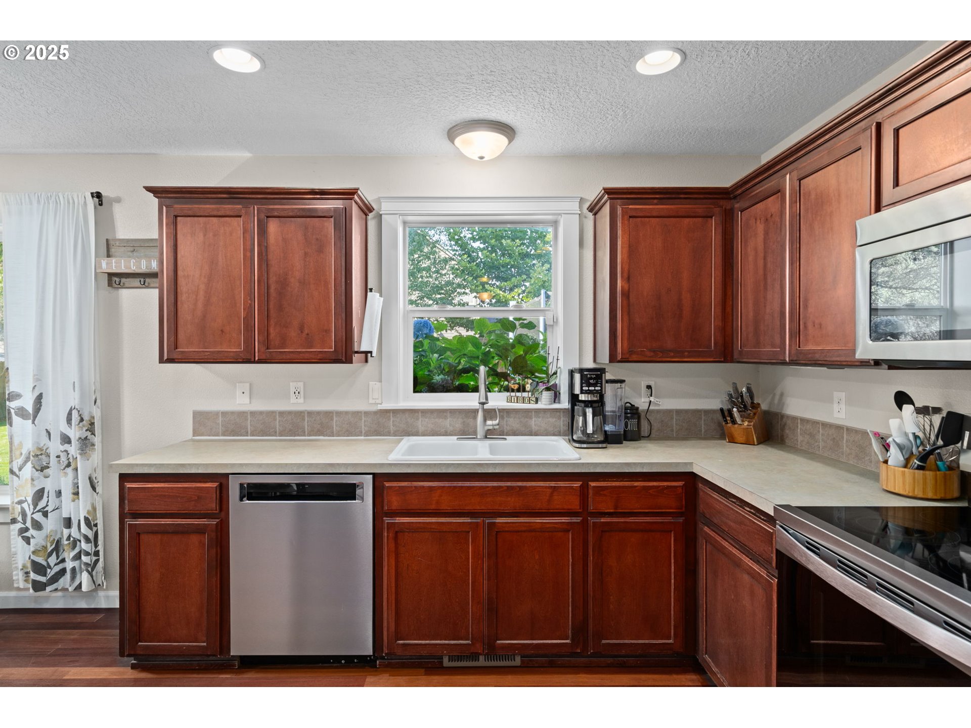 720 East Azalea Street Yamhill, OR 97148 - Photo 17 of 48 a kitchen with a sink cabinets and window