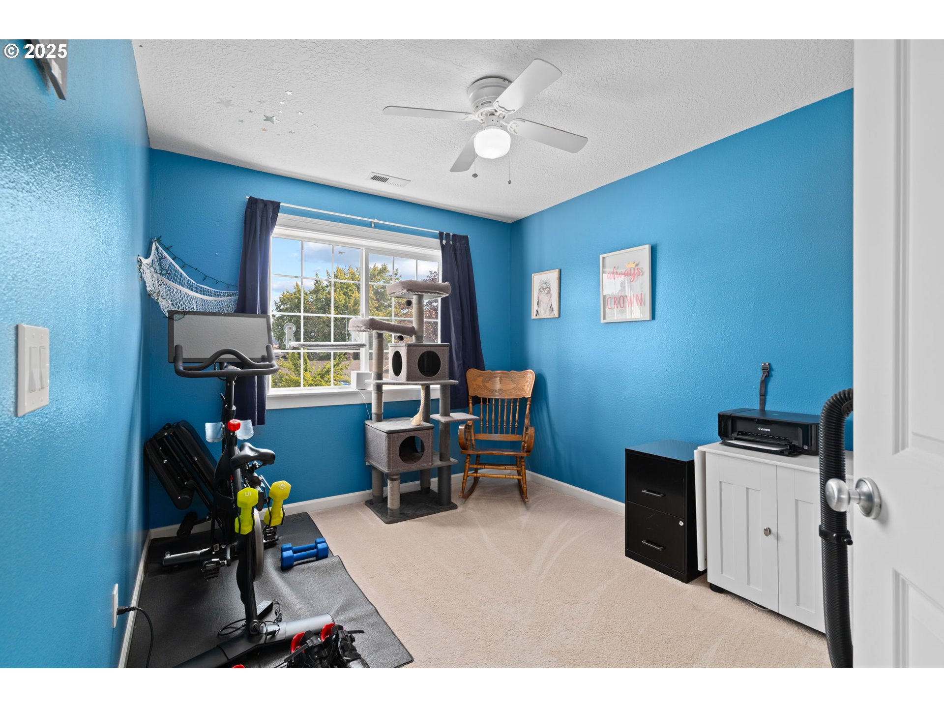 720 East Azalea Street Yamhill, OR 97148 - Photo 26 of 48 a living room with furniture a window and a flat screen tv