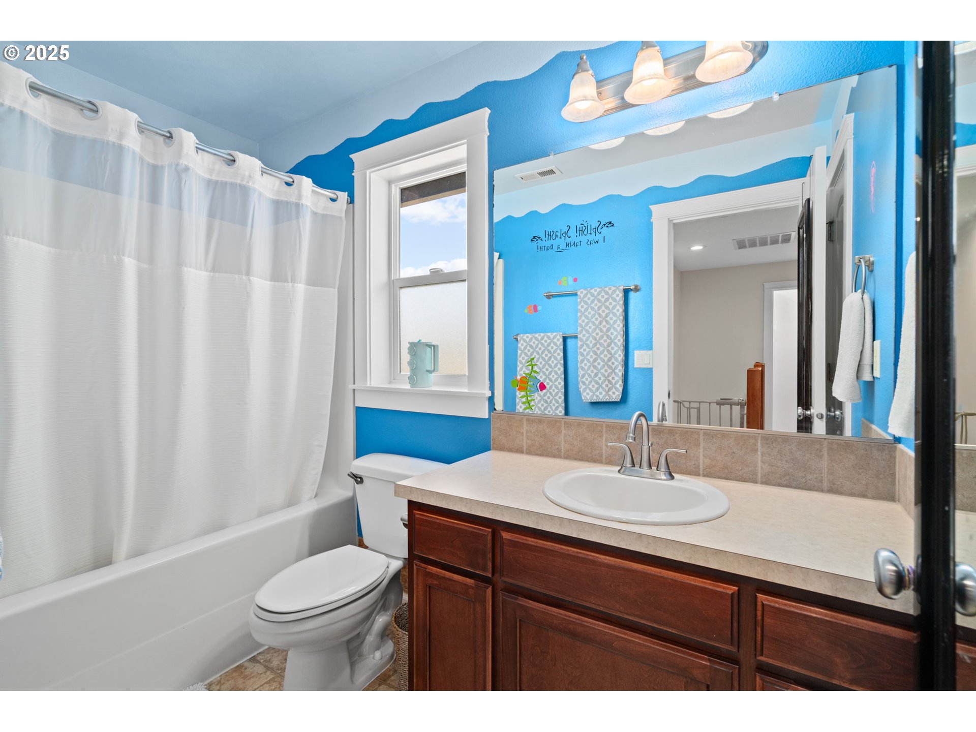 720 East Azalea Street Yamhill, OR 97148 - Photo 28 of 48 a bathroom with a sink vanity mirror and toilet