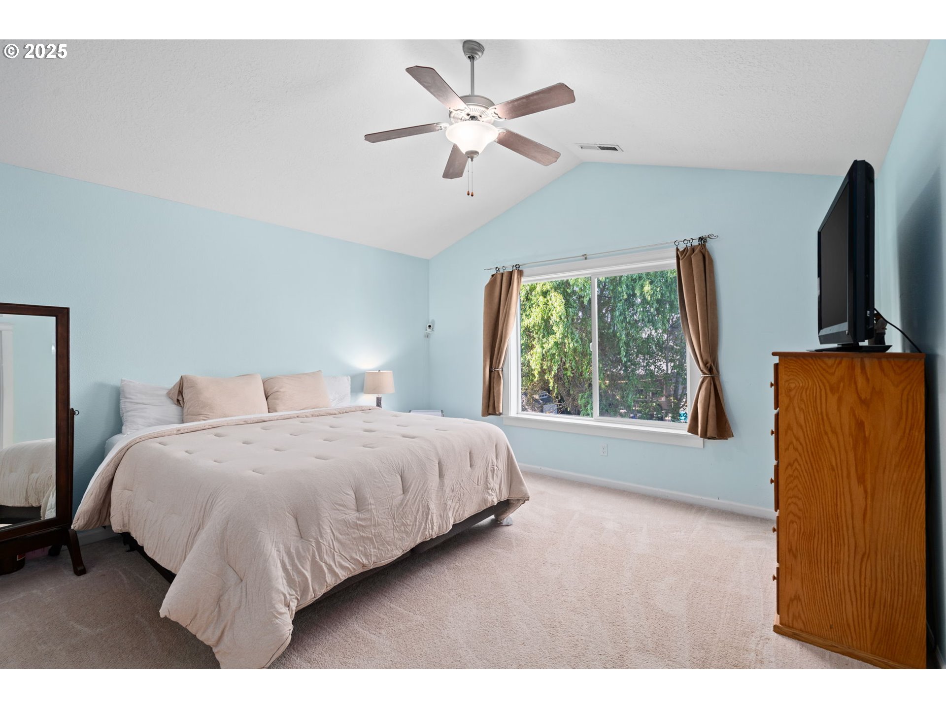 720 East Azalea Street Yamhill, OR 97148 - Photo 29 of 48 a bedroom with a bed window and a flat screen tv