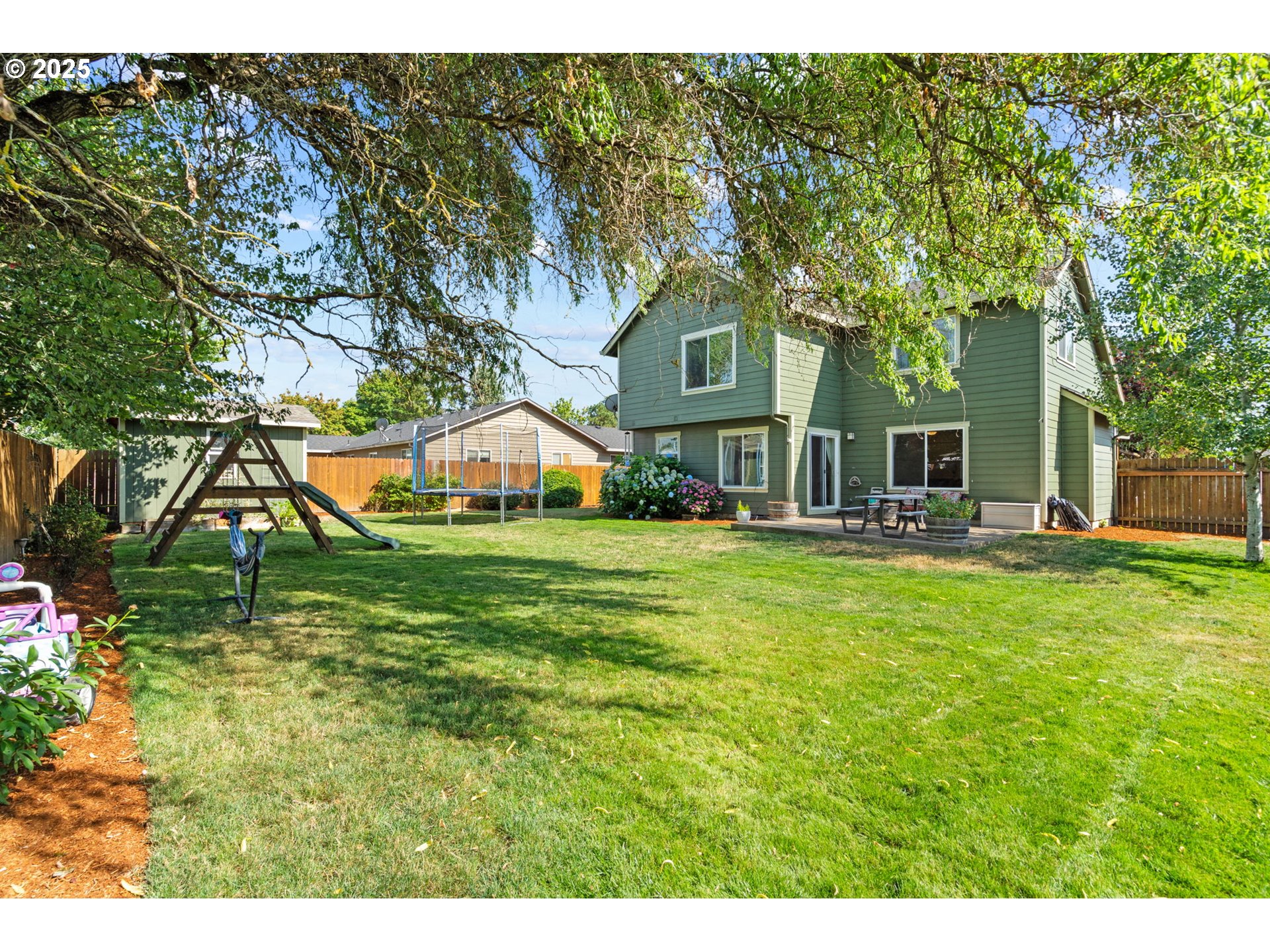 720 East Azalea Street Yamhill, OR 97148 - Photo 34 of 48 a backyard of a house with table and chairs