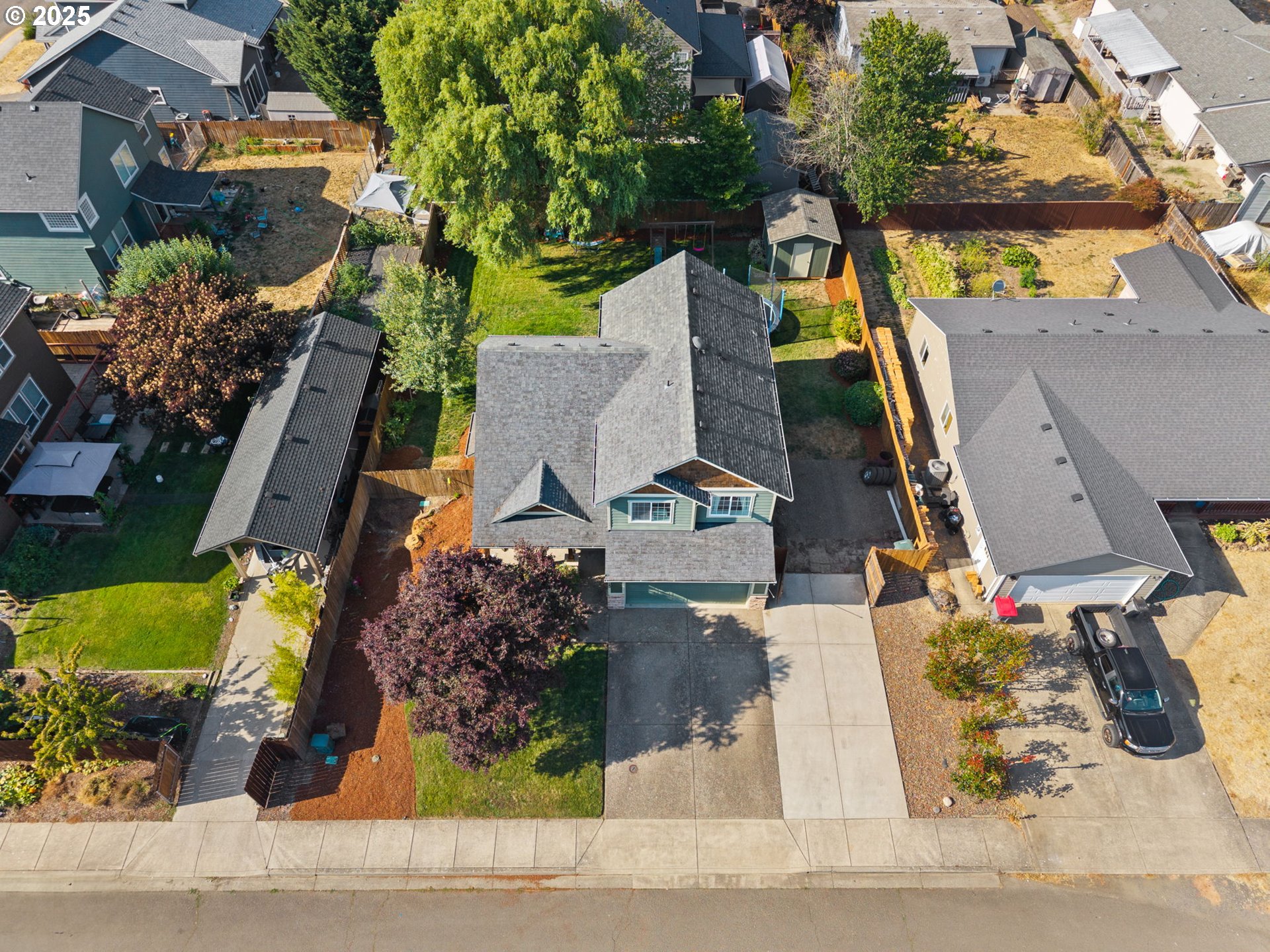 720 East Azalea Street Yamhill, OR 97148 - Photo 43 of 48 an aerial view of a house with a yard and potted plants