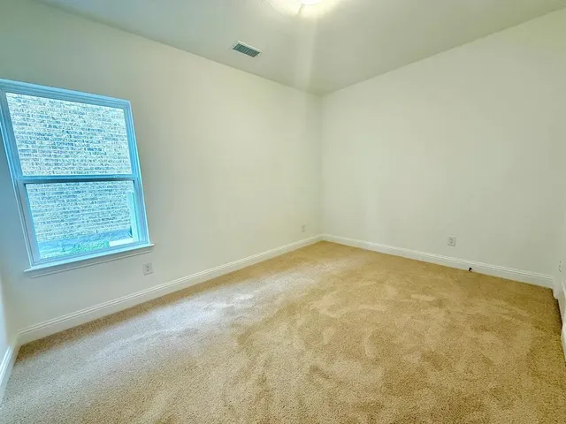 a bathroom with a sink toilet and a mirror