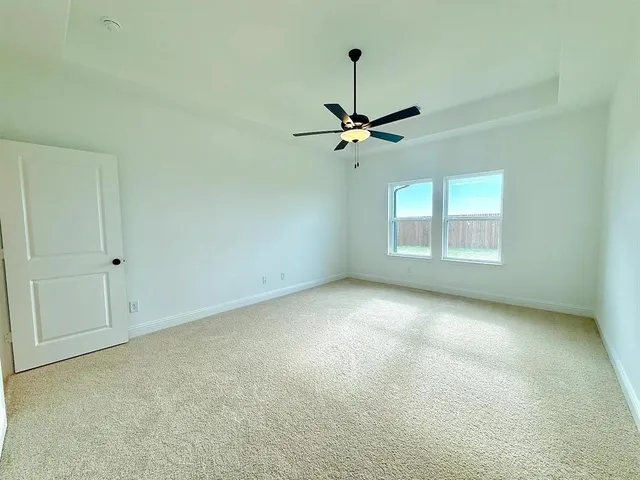 a spacious bathroom with a shower sink and mirror