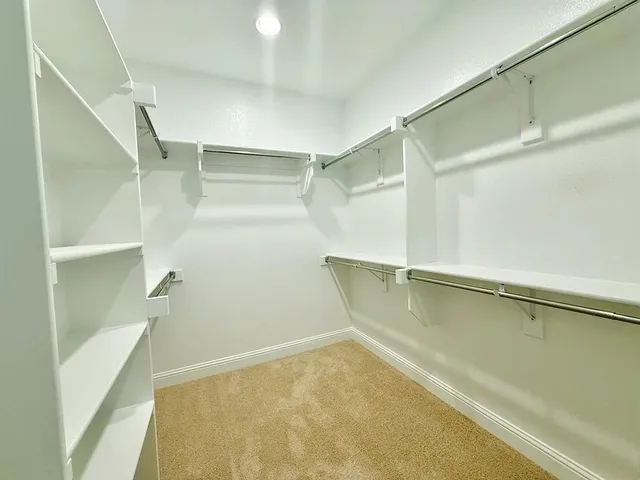 a view of an empty walk in closet