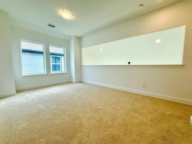 a bathroom with a sink a toilet a mirror a bathtub and shower