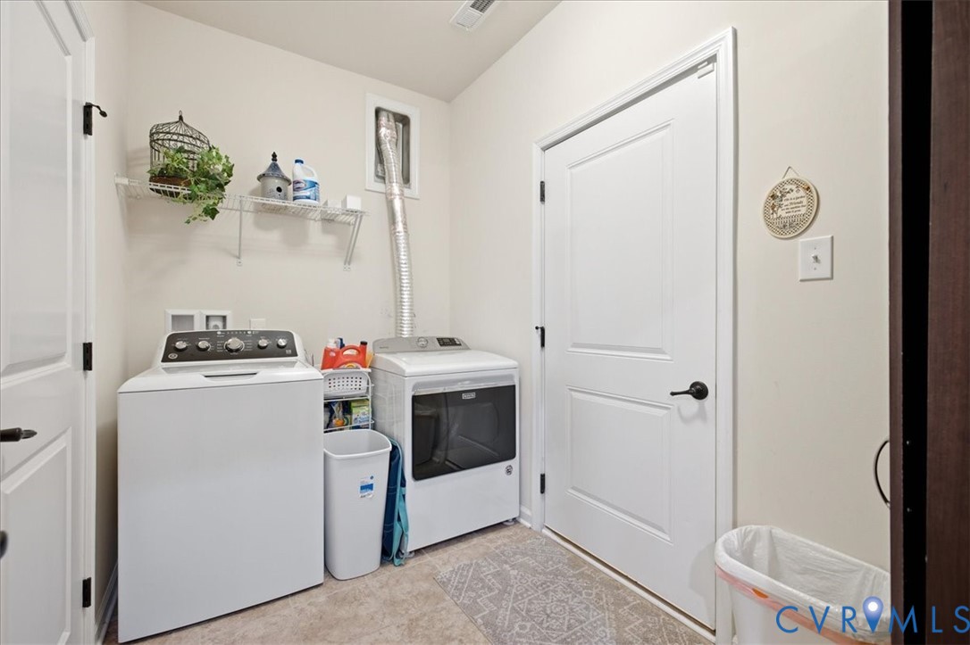 5716 Riverside Place Richmond, VA 23225 - Photo 31 of 33 Laundry area with light neutral wall paint, tile f