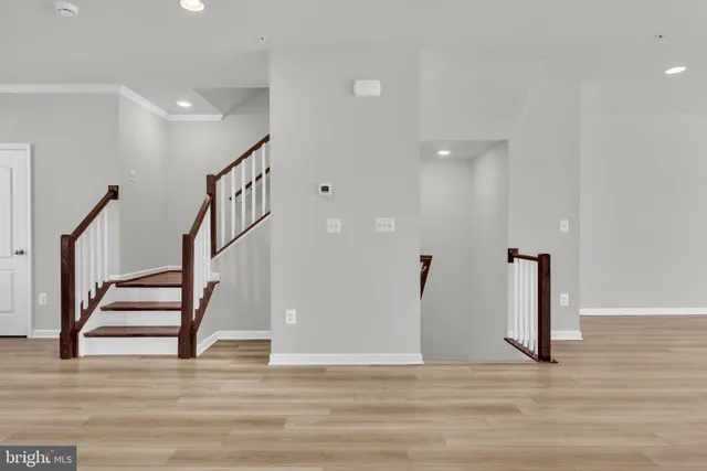 a large kitchen with kitchen island a stove a sink a dining table and chairs