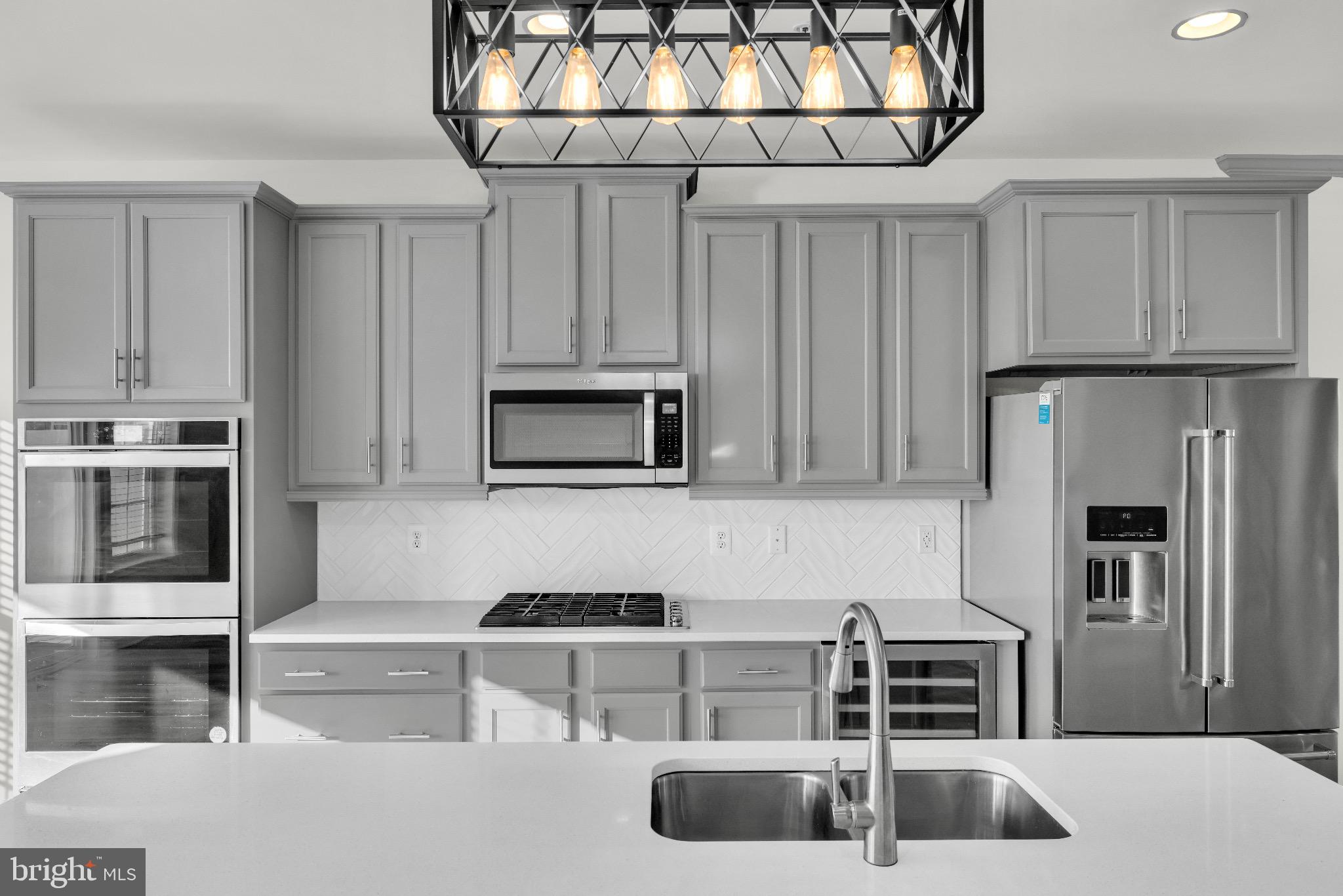 1106 Overlook Loop Laurel, MD 20707 - Photo 13 of 66 Sleek modern kitchen with elegant finishes.