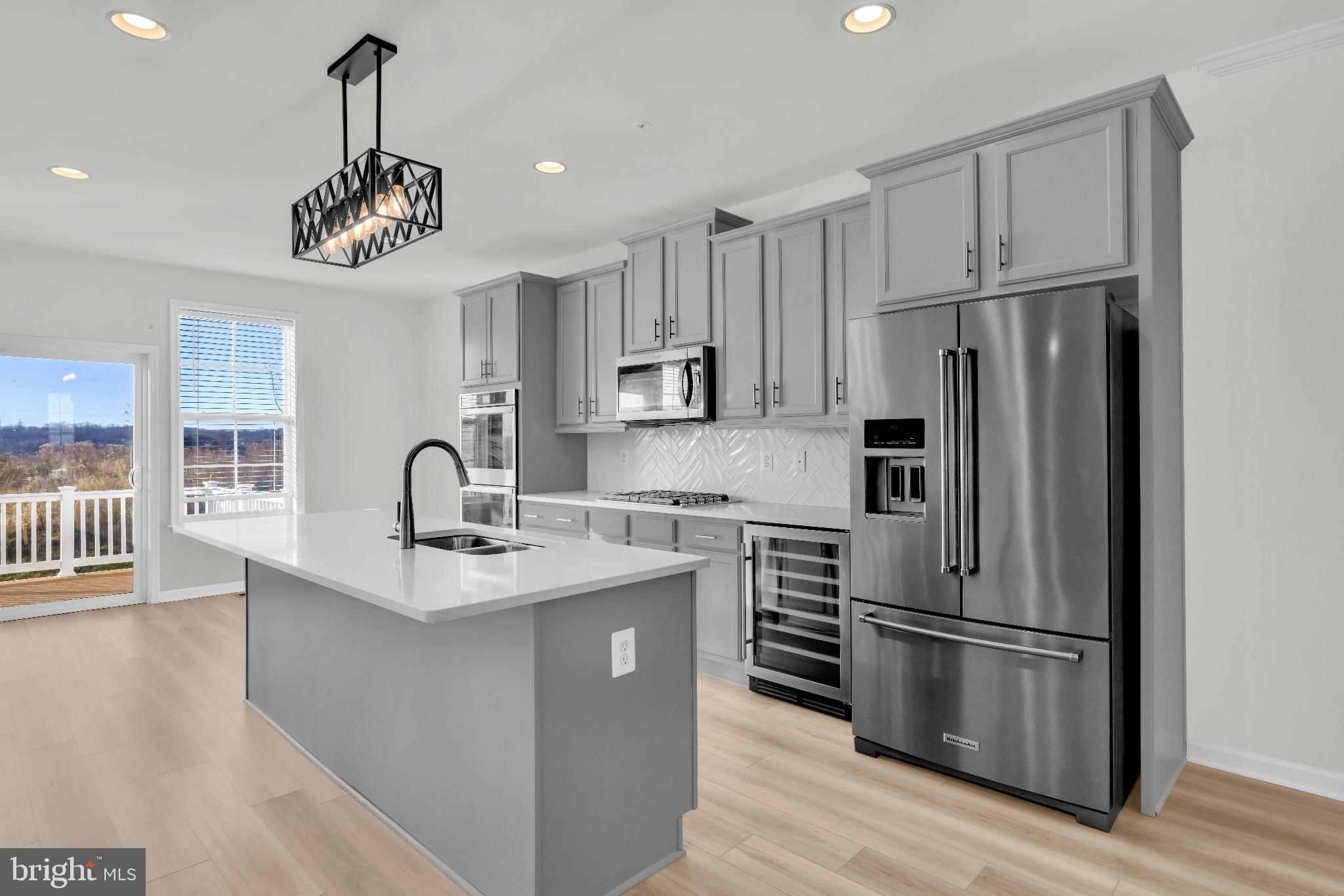 1106 Overlook Loop Laurel, MD 20707 - Photo 16 of 66 Sleek modern kitchen with elegant finishes.