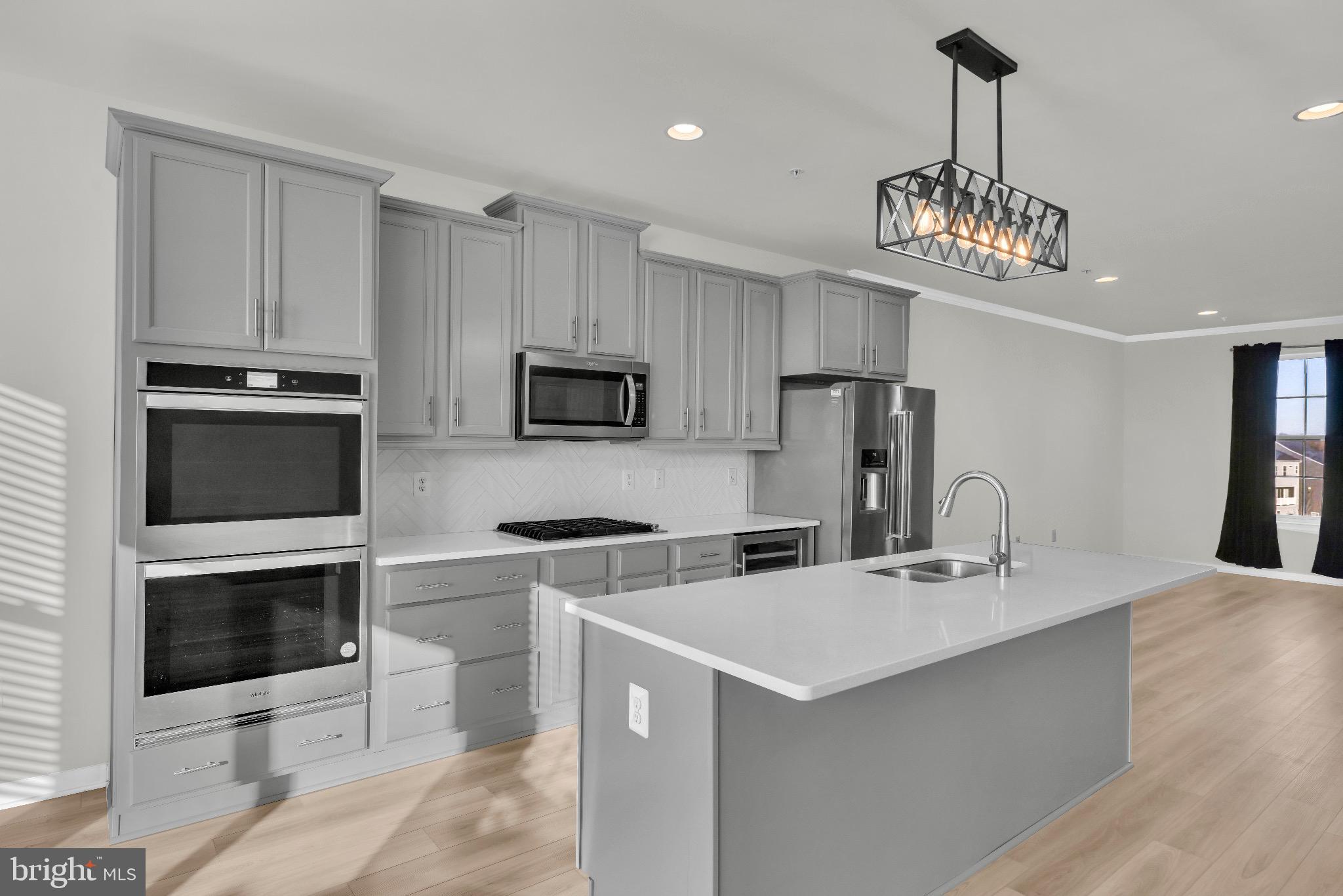 1106 Overlook Loop Laurel, MD 20707 - Photo 17 of 66 Sleek modern kitchen with elegant finishes.