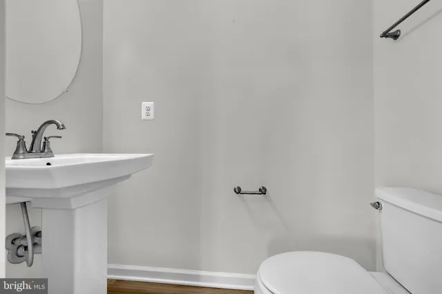 a bedroom with a bed and a potted plant