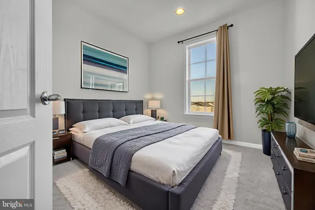 a bathroom with a sink toilet vanity and shower