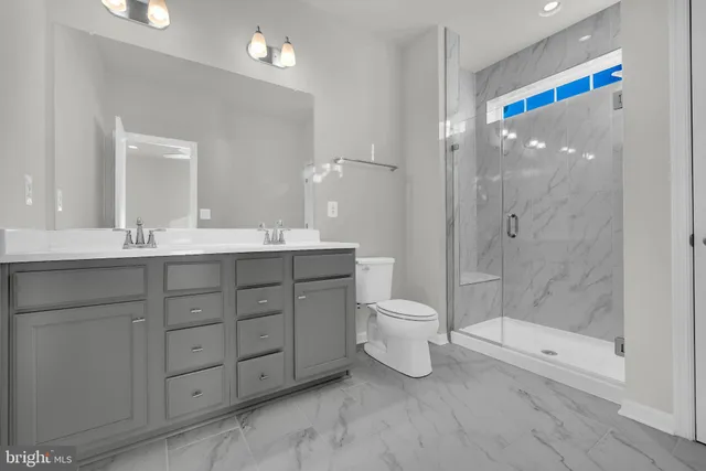 a view of a swimming pool with outdoor seating and plants