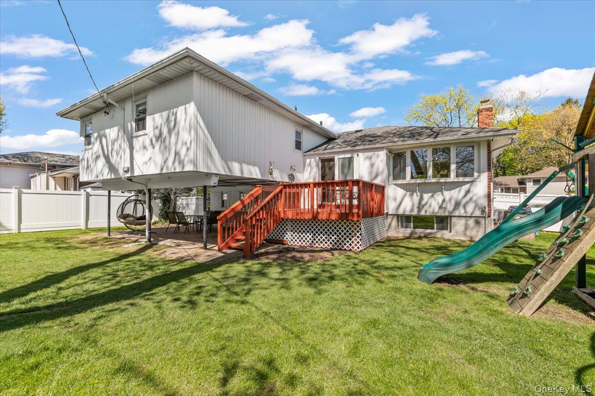 61 Winthrop Road Plainview, NY 11803 - Photo 29 of 37 a view of a house with a yard