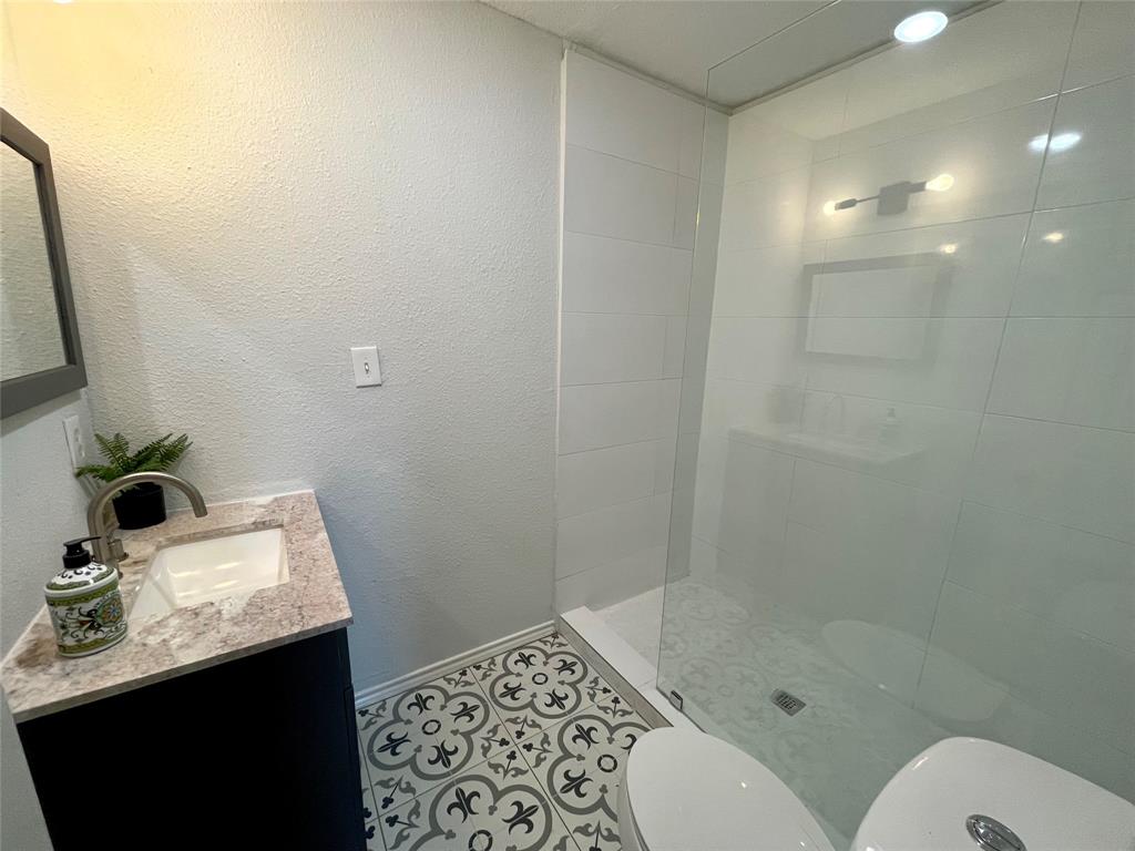7976 Bearhill Road Royse City, TX 75189 - Photo 16 of 27 a bathroom with a sink toilet and shower