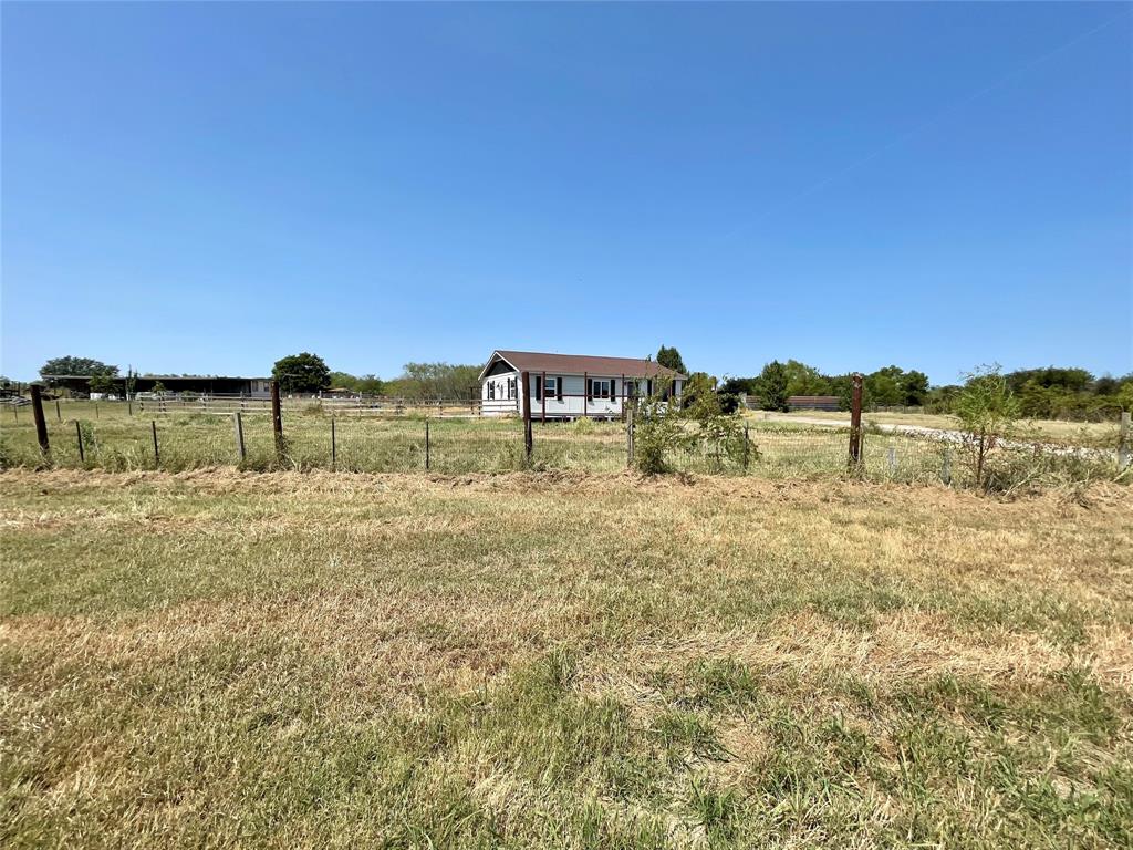 7976 Bearhill Road Royse City, TX 75189 - Photo 2 of 27 a view of a yard with an ocean