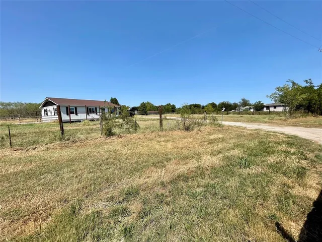 a view of a lake with houses in the back