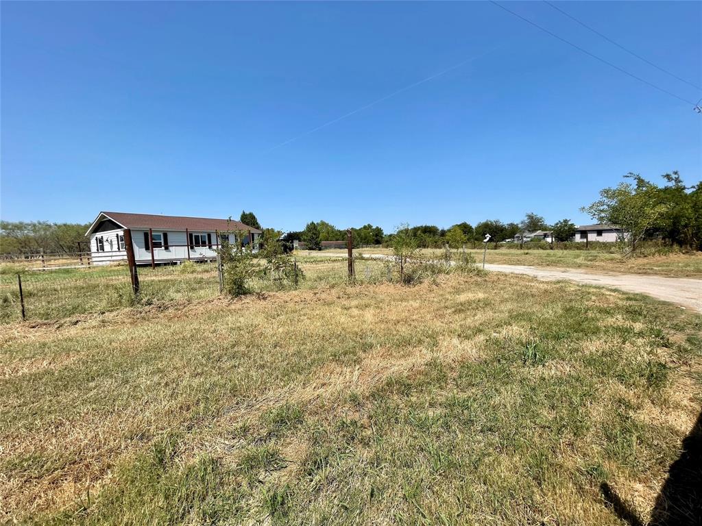 7976 Bearhill Road Royse City, TX 75189 - Photo 25 of 27 a view of a lake with houses in the back