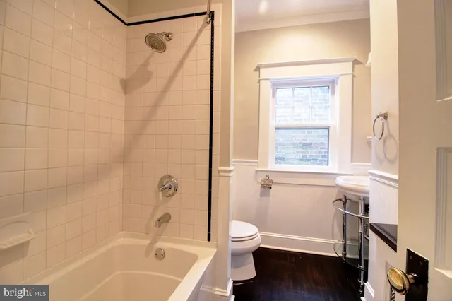 a bathroom with a sink a mirror and a window