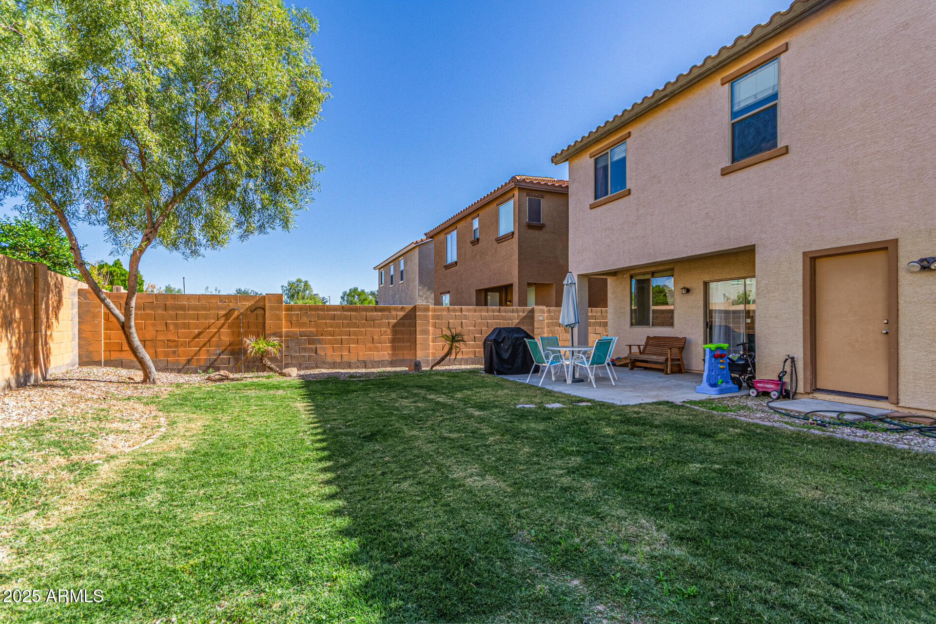3802 East Chickadee Road Gilbert, AZ 85297 - Photo 29 of 29 a view of a house with a yard