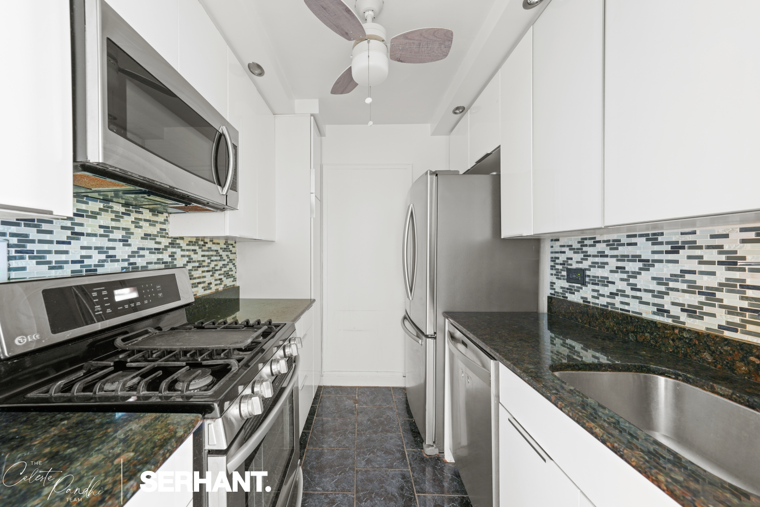 225 East 36th Street, Unit 2N Manhattan, NY 10016 - Photo 13 of 28 a kitchen with stainless steel appliances granite countertop a sink and a stove