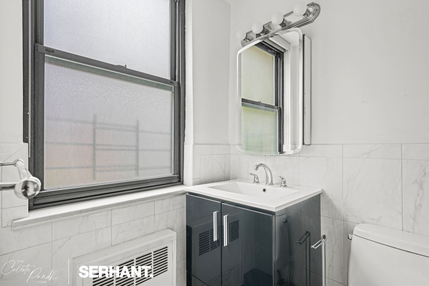 225 East 36th Street, Unit 2N Manhattan, NY 10016 - Photo 14 of 28 a bathroom with a sink and a mirror