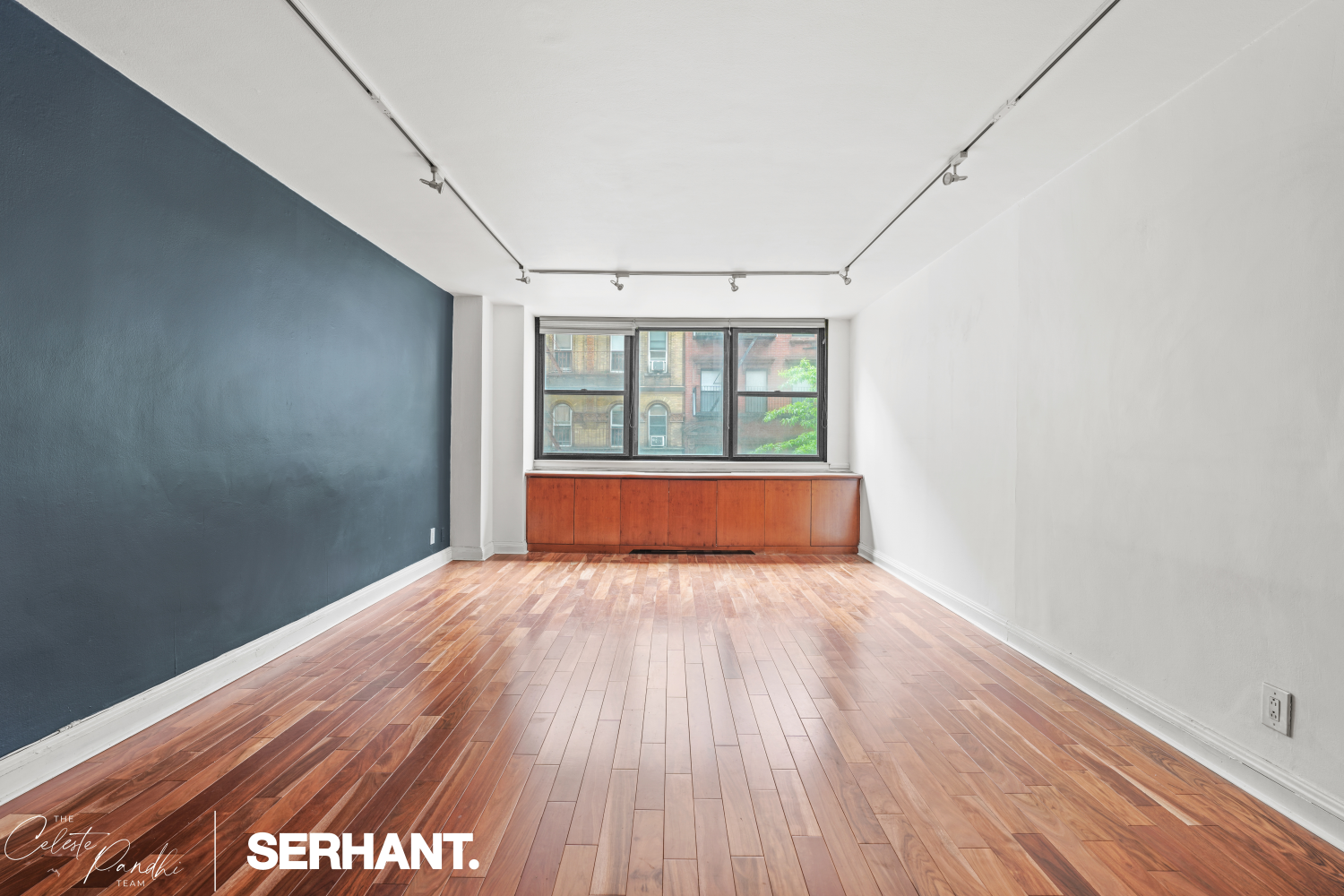 225 East 36th Street, Unit 2N Manhattan, NY 10016 - Photo 3 of 28 a view of an empty room with a window and wooden floor
