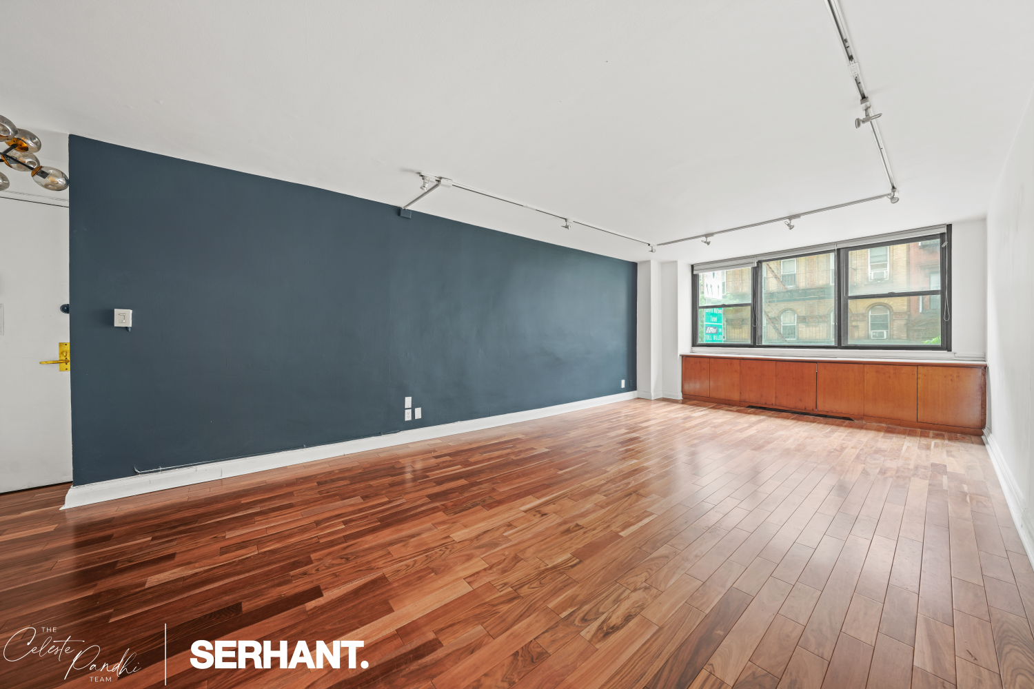 225 East 36th Street, Unit 2N Manhattan, NY 10016 - Photo 4 of 28 a view of empty room with wooden floor and fan