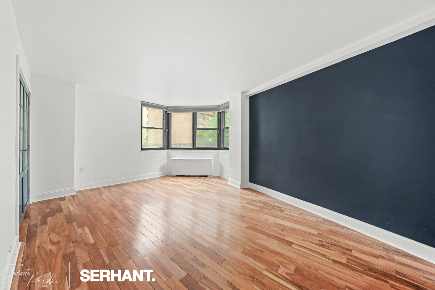 225 East 36th Street, Unit 2N Manhattan, NY 10016 - Photo 7 of 28 a view of empty room with wooden floor and fan