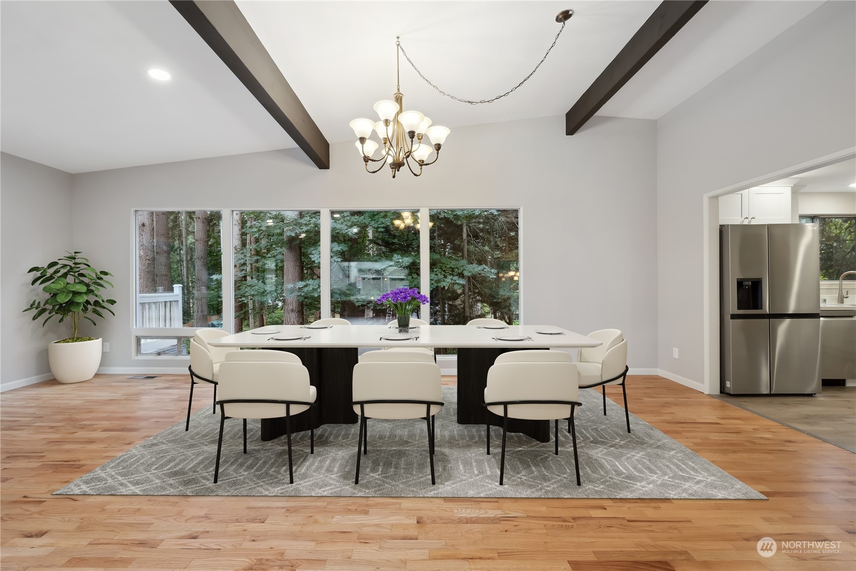2130 242nd Street Southwest Bothell, WA 98021 - Photo 11 of 40 a view of a dining room with furniture window and wooden floor