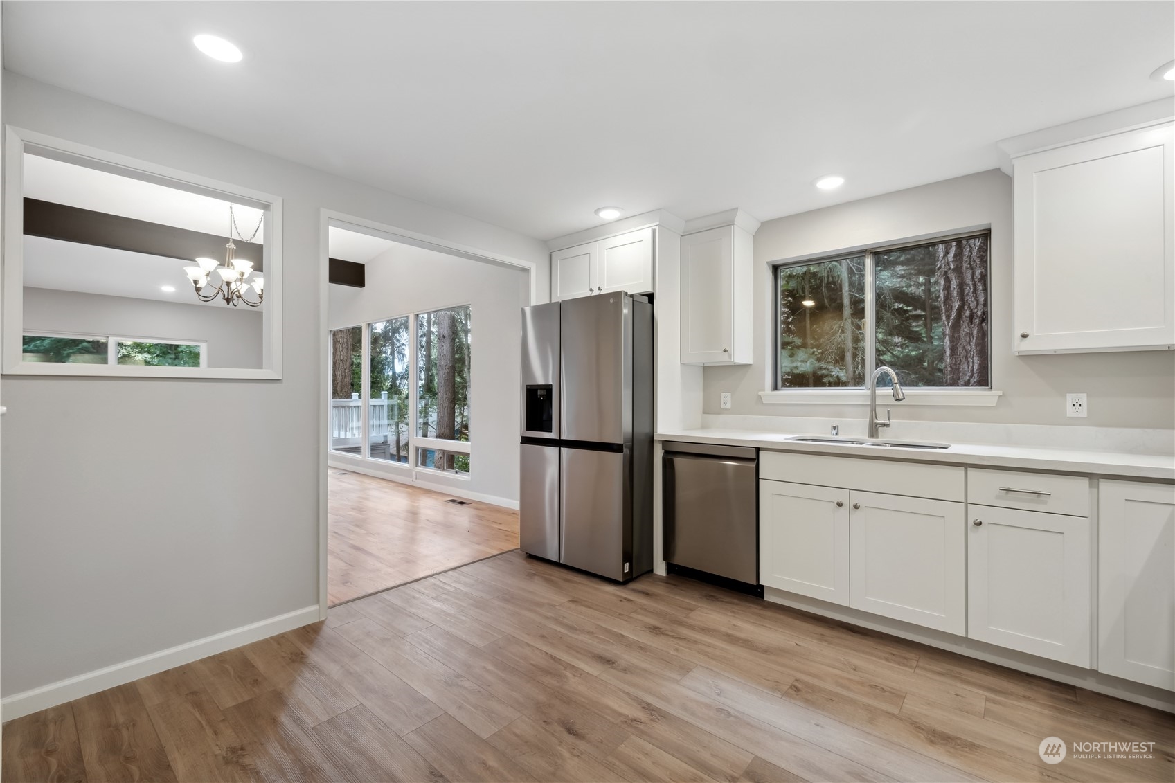 2130 242nd Street Southwest Bothell, WA 98021 - Photo 12 of 40 a kitchen with a refrigerator and a sink
