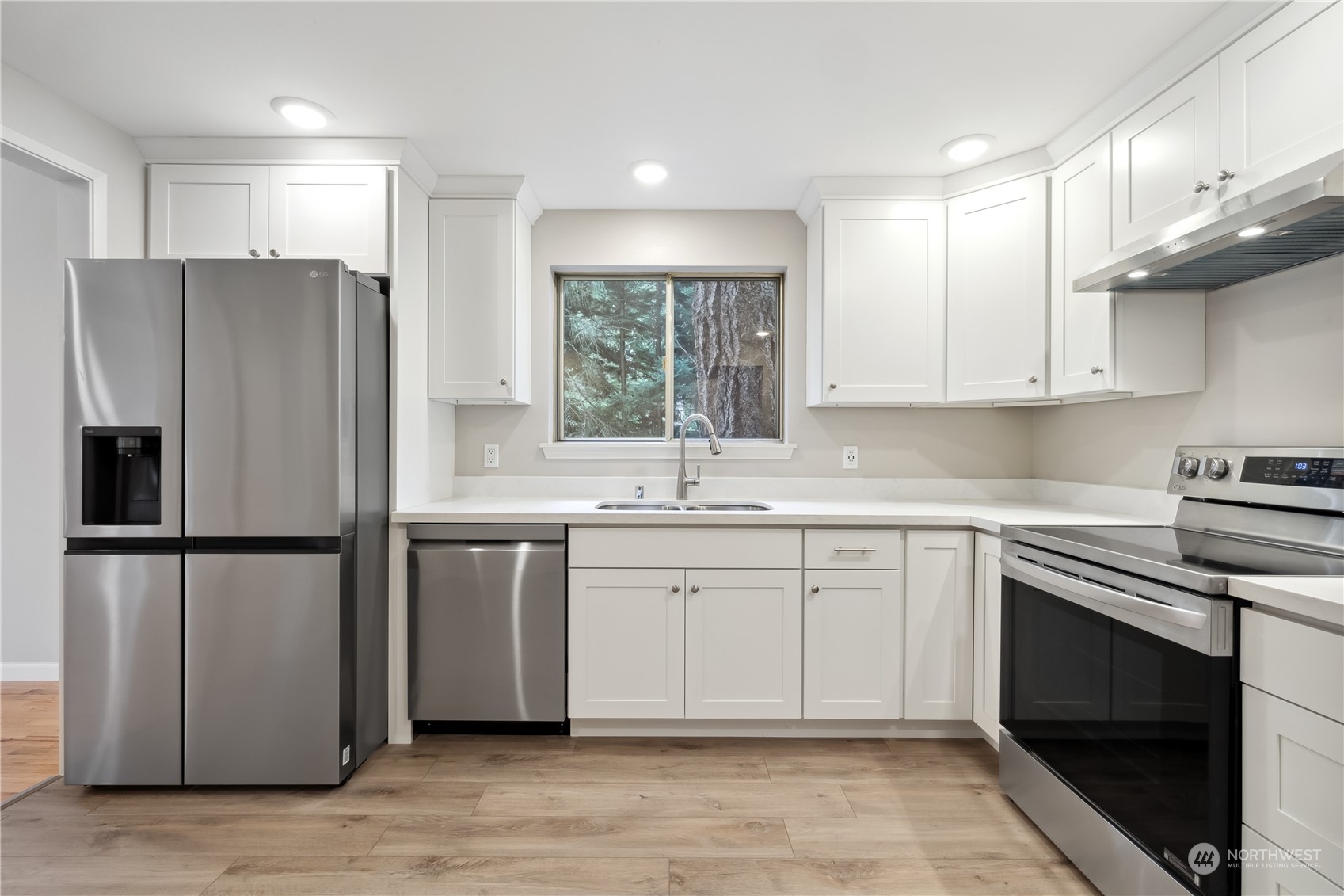 2130 242nd Street Southwest Bothell, WA 98021 - Photo 13 of 40 a kitchen with a refrigerator stove and sink