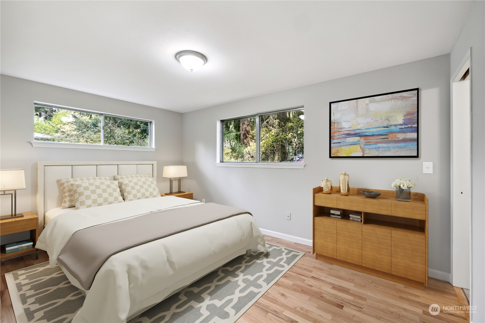 2130 242nd Street Southwest Bothell, WA 98021 - Photo 16 of 40 a bedroom with a bed and a painting on the wall
