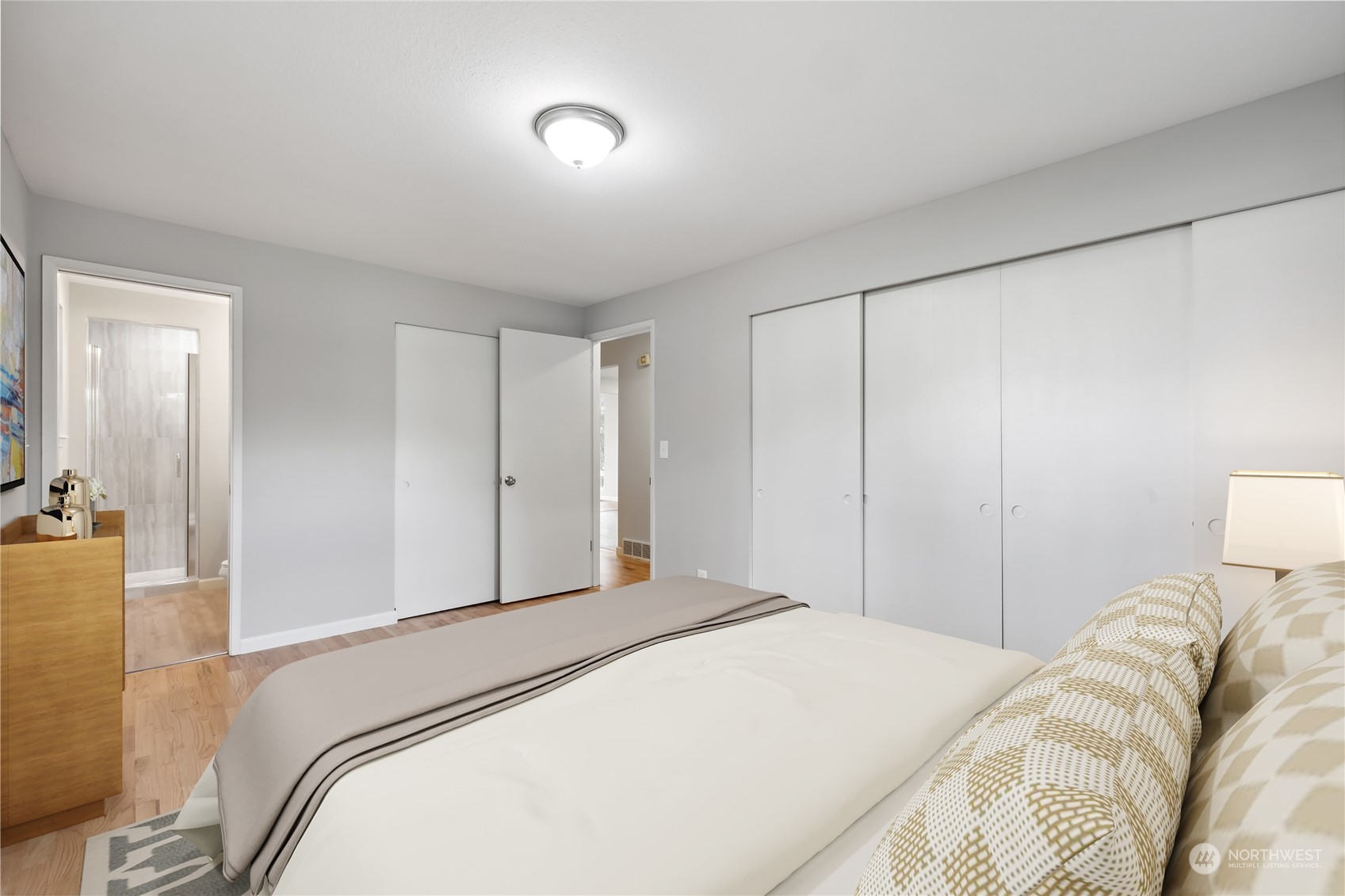 2130 242nd Street Southwest Bothell, WA 98021 - Photo 17 of 40 a bedroom with a bed and a lamp