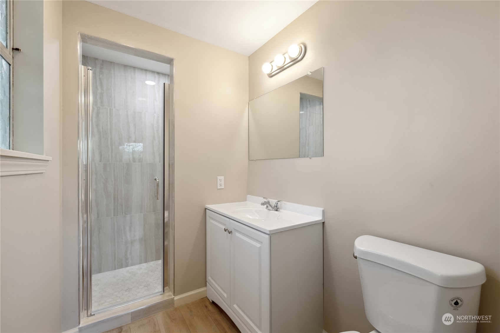 2130 242nd Street Southwest Bothell, WA 98021 - Photo 18 of 40 a bathroom with a toilet a sink and mirror