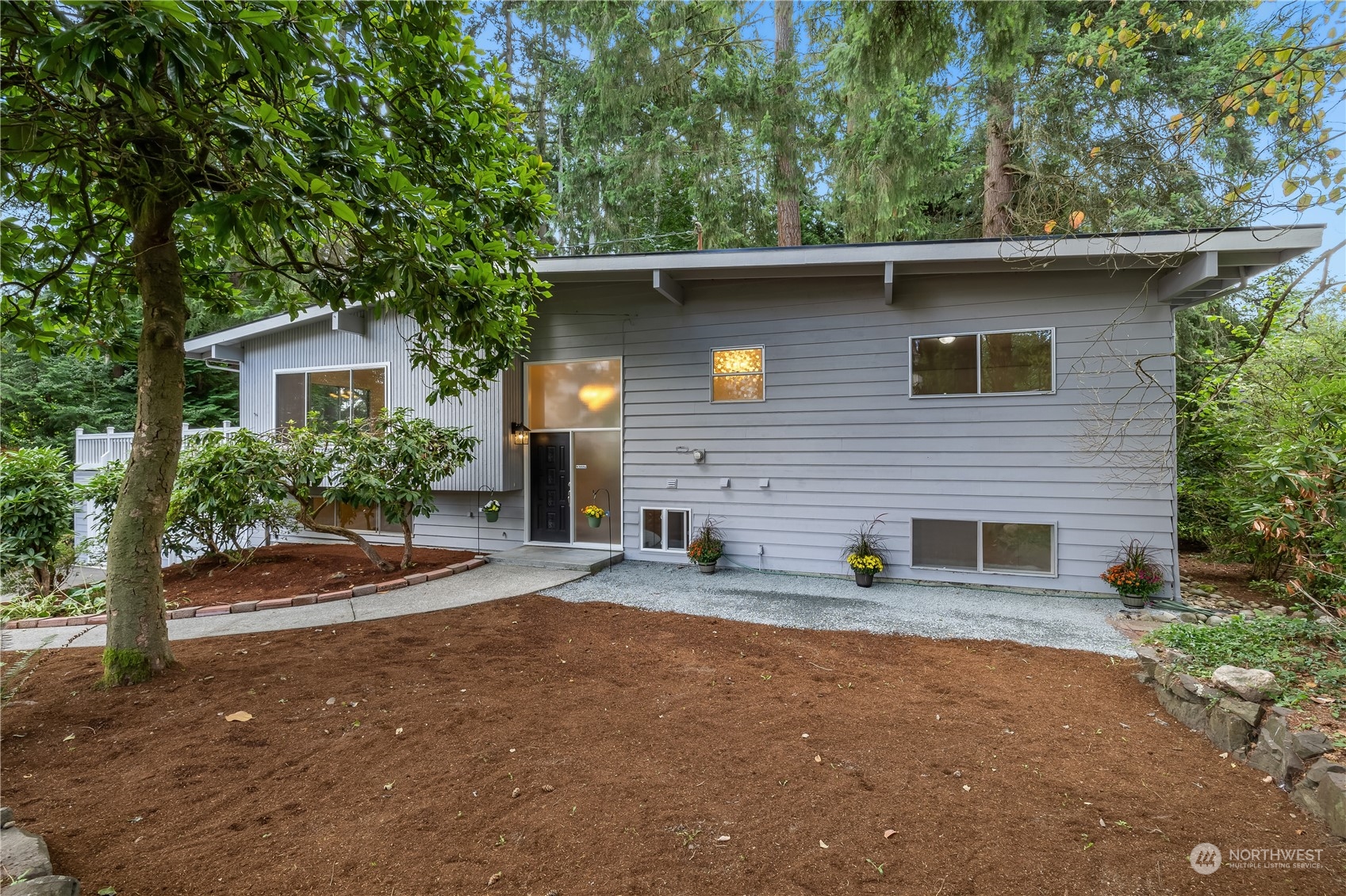 2130 242nd Street Southwest Bothell, WA 98021 - Photo 2 of 40 a front view of a house with a yard