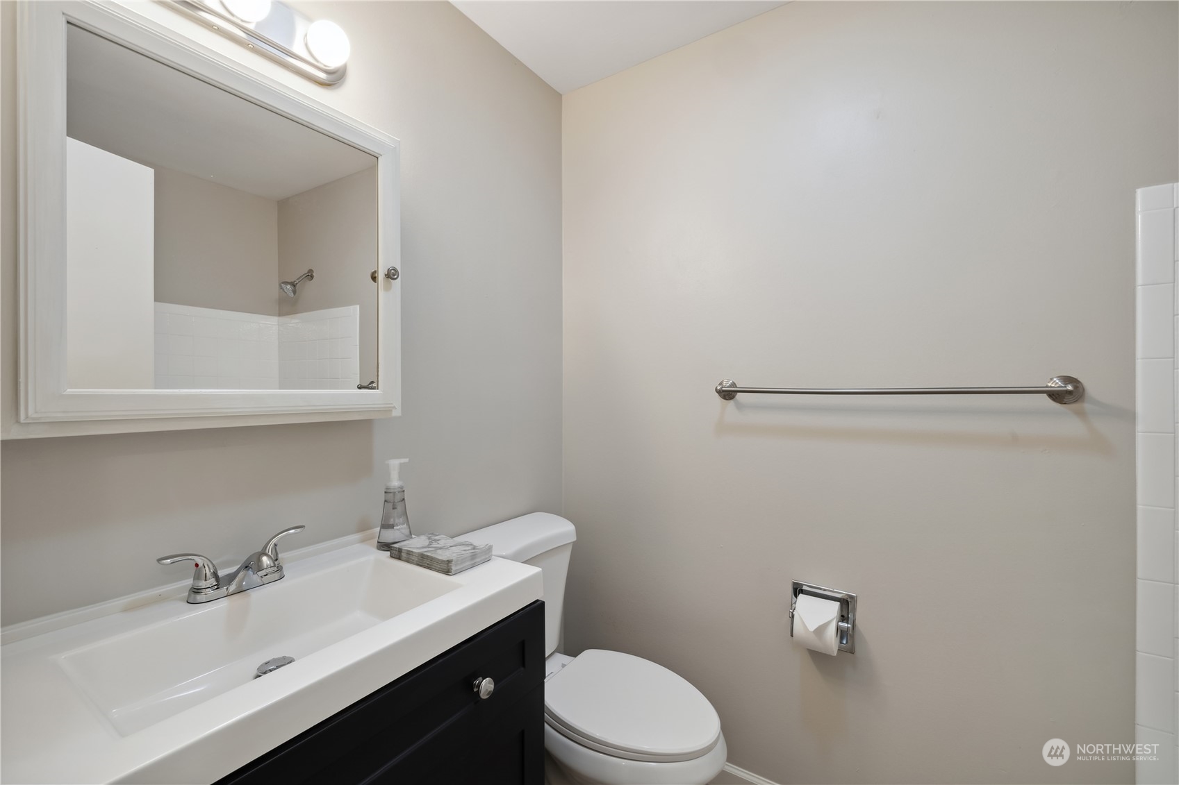 2130 242nd Street Southwest Bothell, WA 98021 - Photo 21 of 40 a bathroom with a sink toilet and mirror