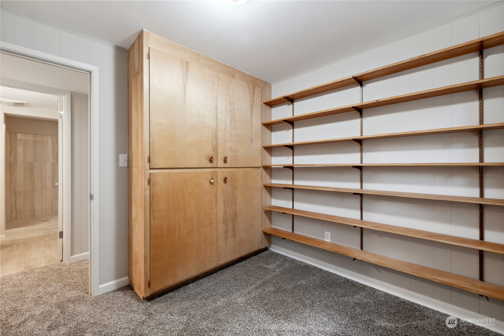 2130 242nd Street Southwest Bothell, WA 98021 - Photo 29 of 40 a view of walk in closet with empty racks