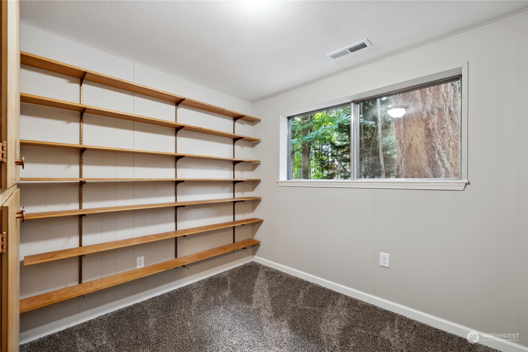 2130 242nd Street Southwest Bothell, WA 98021 - Photo 30 of 40 a view of room with window and shelf