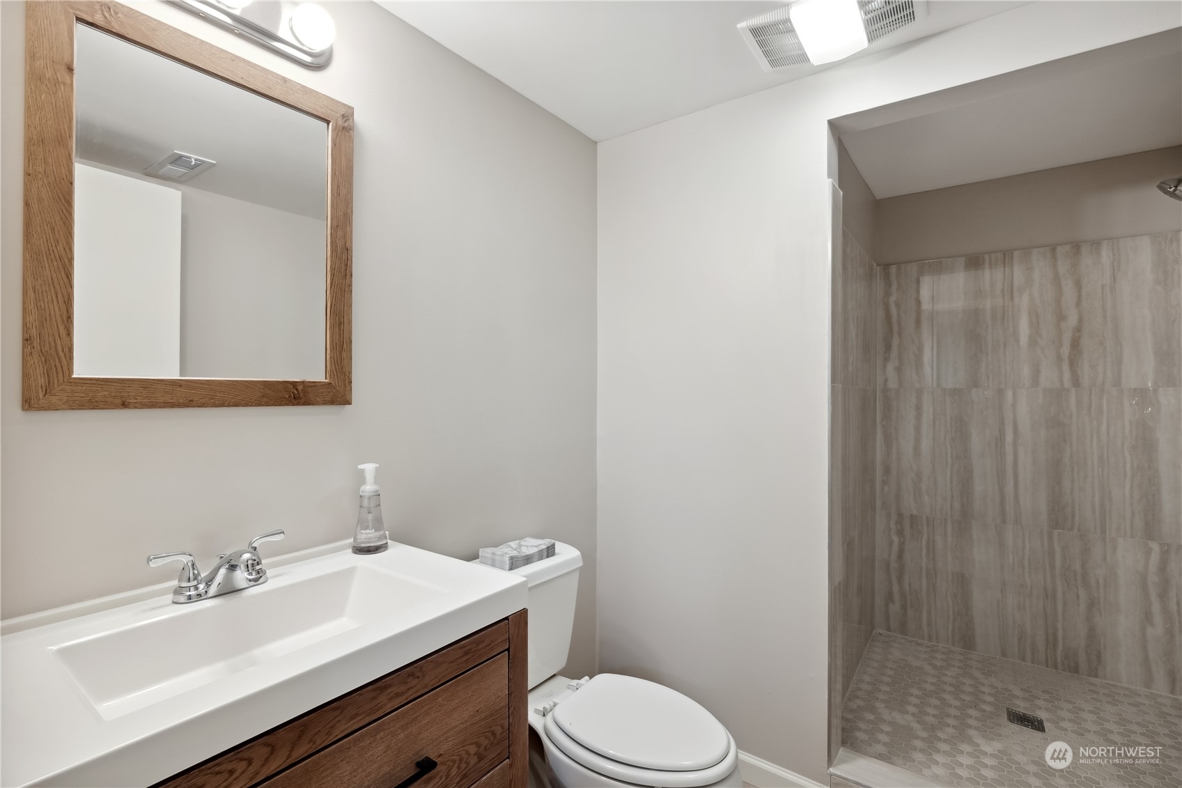2130 242nd Street Southwest Bothell, WA 98021 - Photo 31 of 40 a bathroom with a sink a toilet and shower