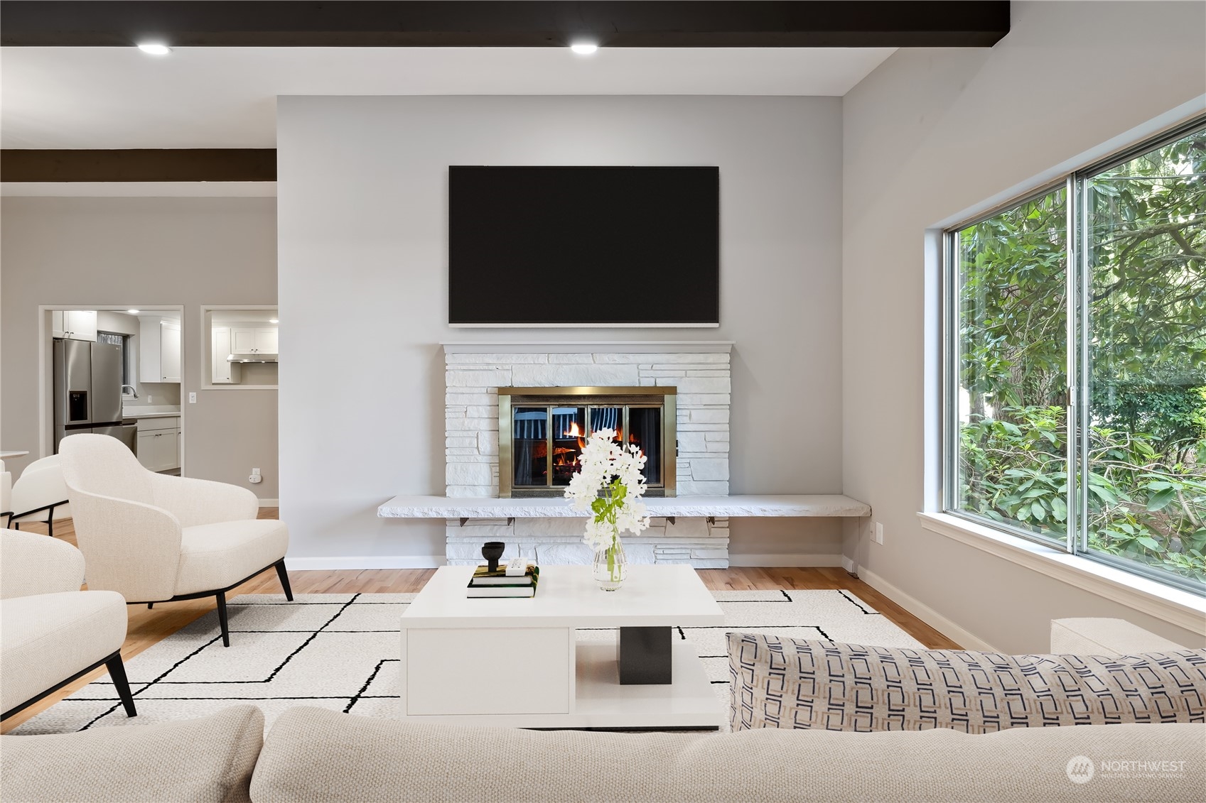 2130 242nd Street Southwest Bothell, WA 98021 - Photo 5 of 40 a living room with fireplace furniture and a flat screen tv