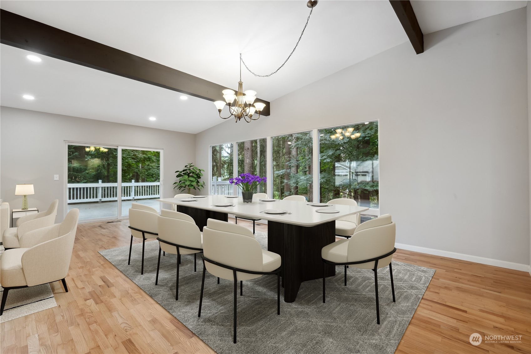 2130 242nd Street Southwest Bothell, WA 98021 - Photo 7 of 40 a view of a dining room with furniture wooden floor and chandelier
