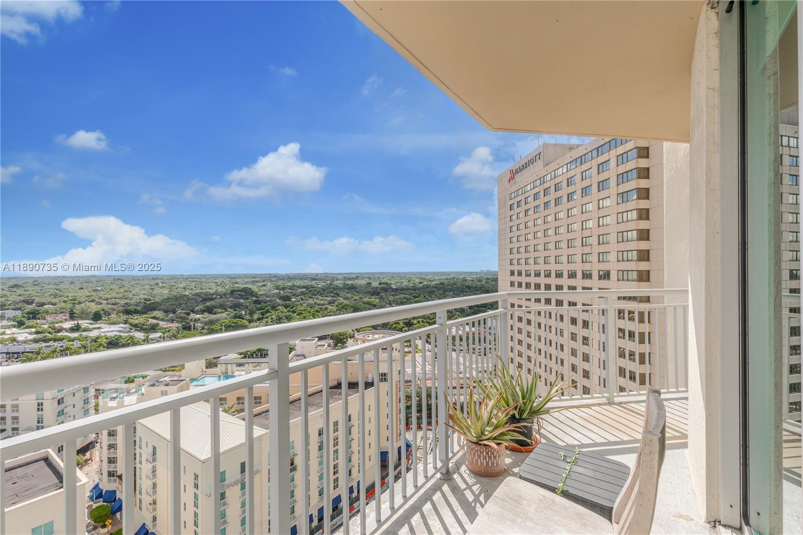 9055 Southwest 73rd Court, Unit 1603 Miami, FL 33156 - Photo 13 of 28 a view of balcony with wooden floor