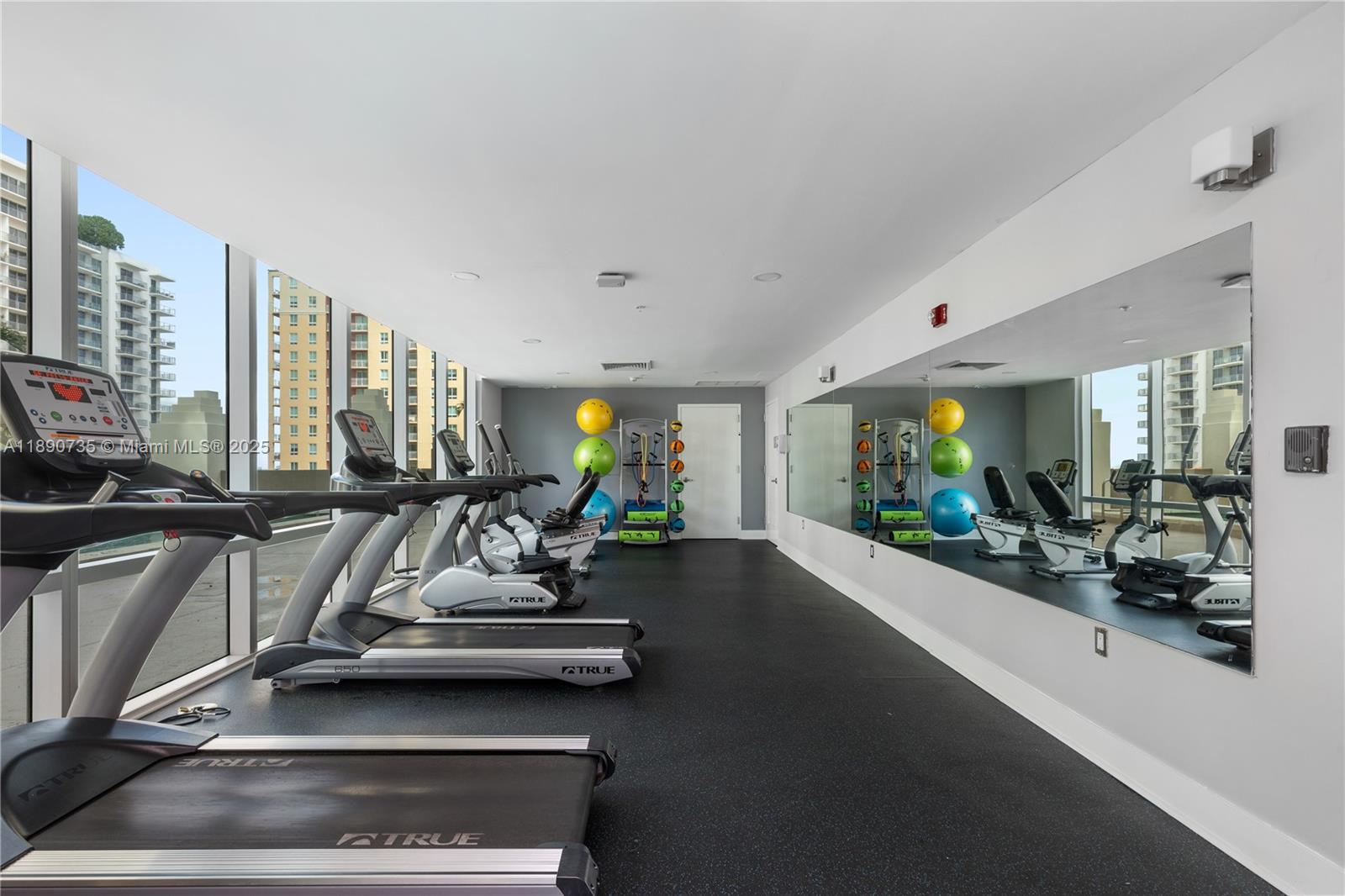 9055 Southwest 73rd Court, Unit 1603 Miami, FL 33156 - Photo 26 of 28 a view of a room with gym equipment