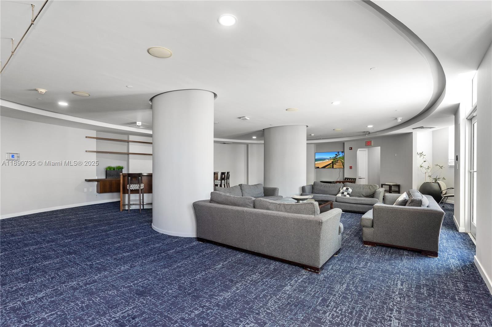 9055 Southwest 73rd Court, Unit 1603 Miami, FL 33156 - Photo 27 of 28 a living room with fireplace furniture and a wooden floor