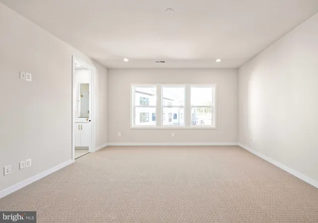 a bathroom with a double vanity sink a mirror and a shower