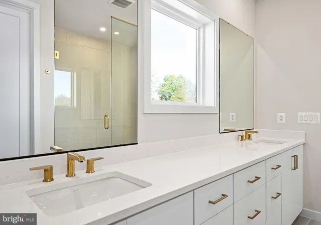 a bathroom with a sink and mirror